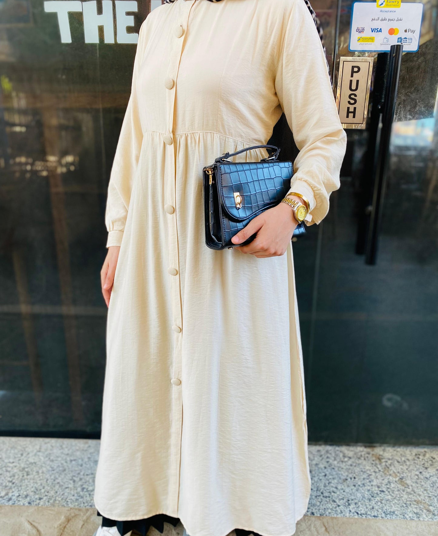Creamy button-front flared dress.