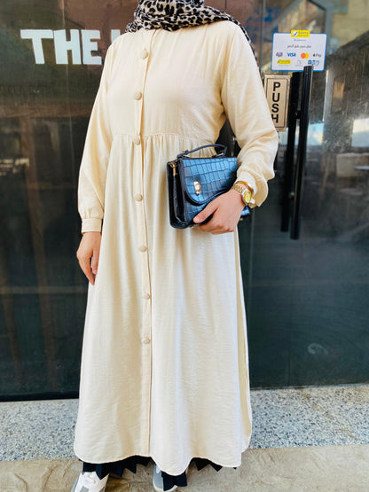 Creamy button-front flared dress.